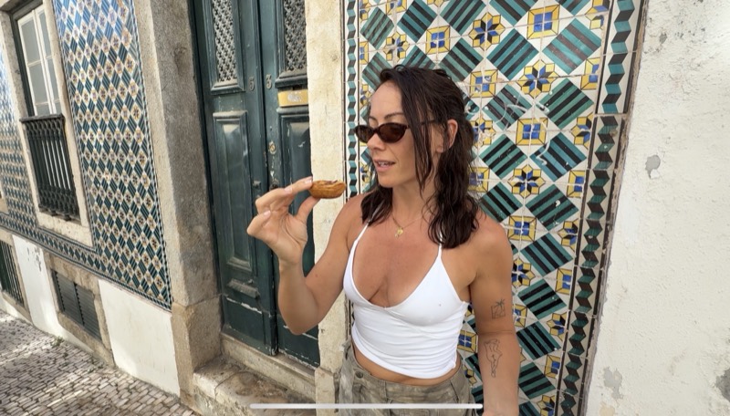 Abbey enjoying a pastel de nata