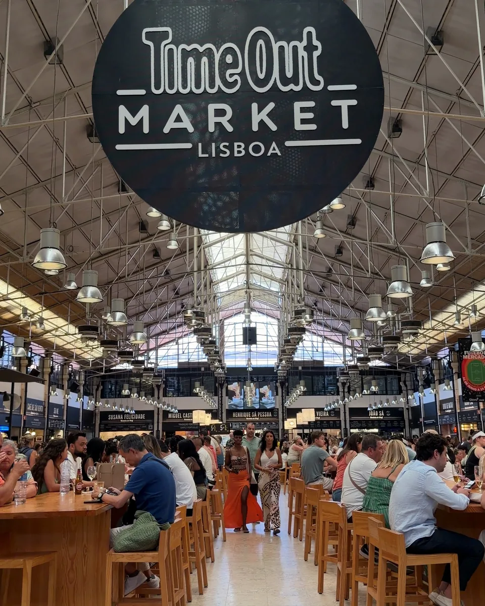 The Time Out Market sign hanging over the long food hall