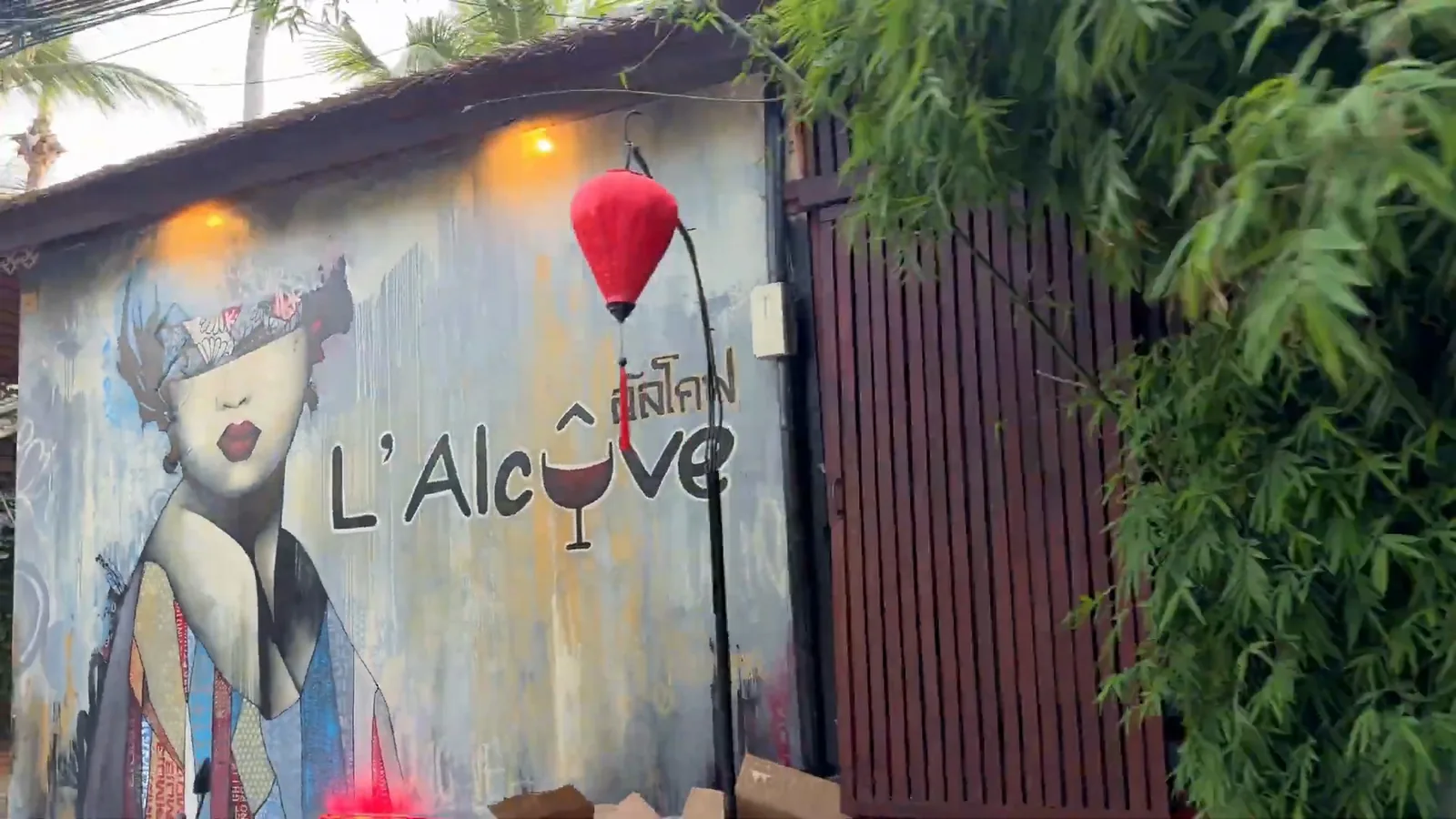 The painted mural and sign at L'Alcove in Hin Kong
